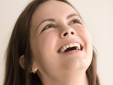 Woman smiling, representing smile line treatments